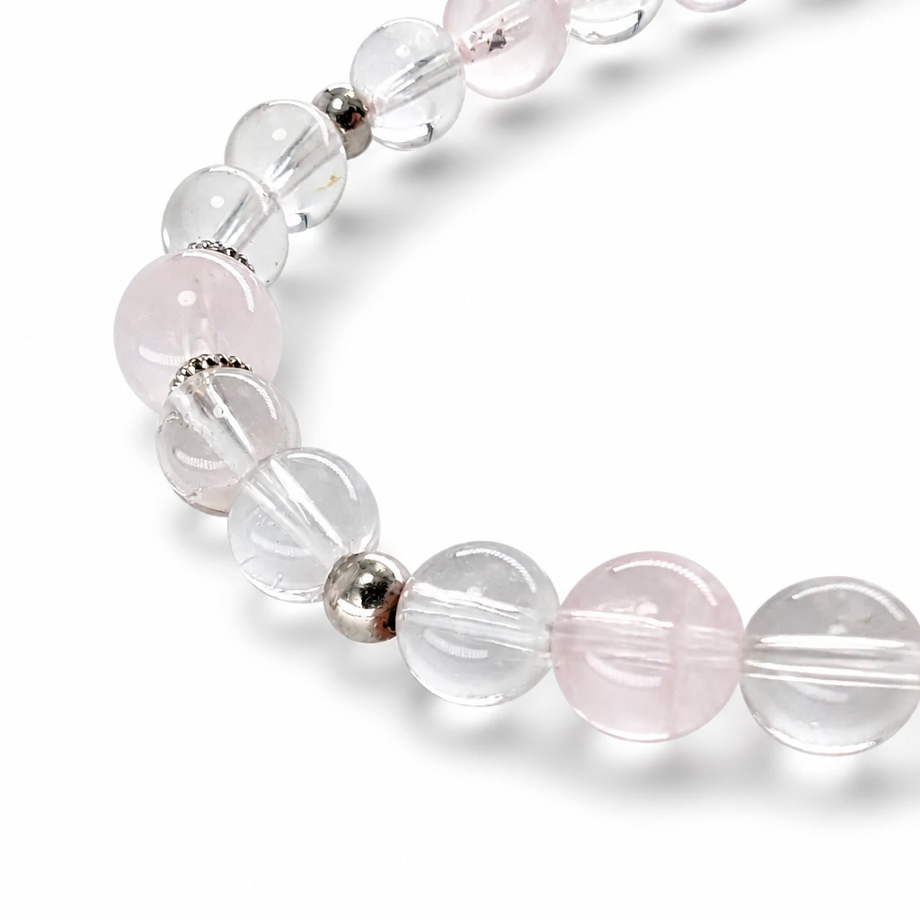 Soft blush Rose Quartz beads flowing from the Amethyst Super 7 centre on white