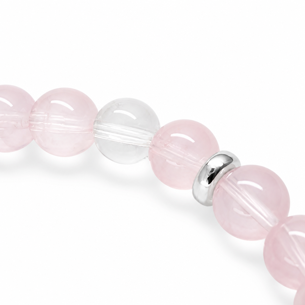 Red-pink Strawberry Quartz beads showing hematite inclusions, side angle
