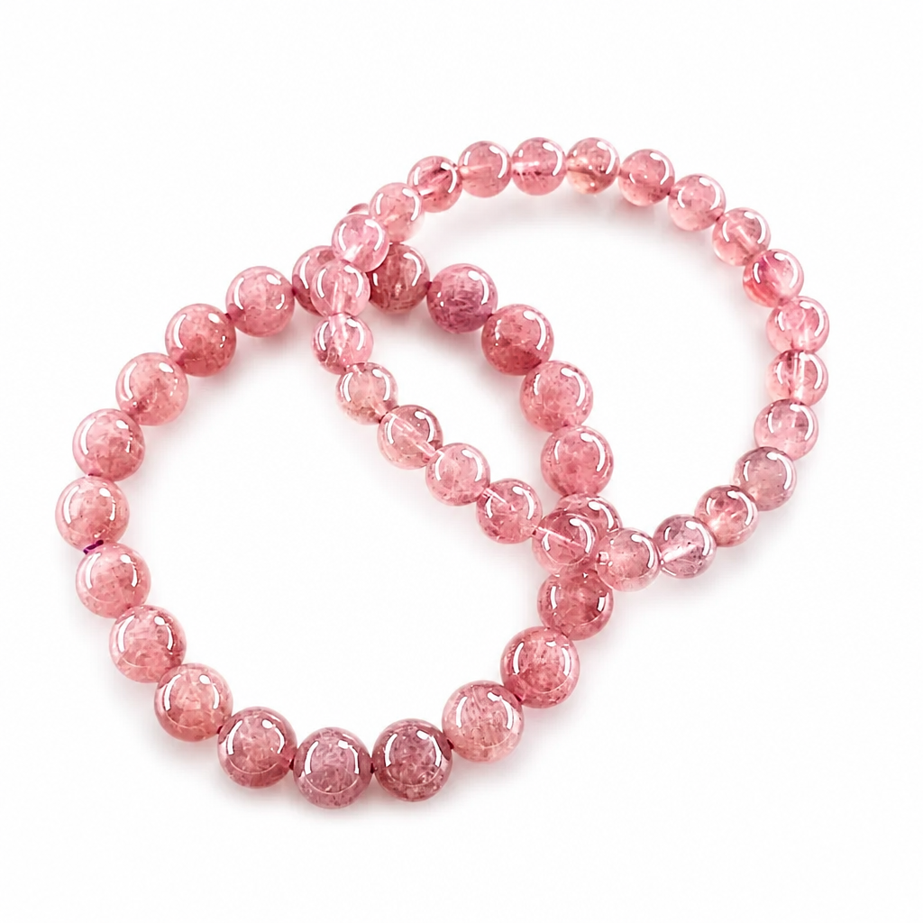 Violet star rose quartz bracelet resting flat, showing even bead colour