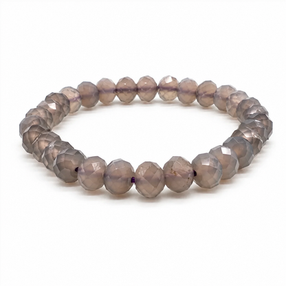 Deep uniform purple chalcedony bead catching the light