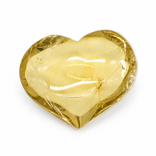 Natural citrine heart held to the light showing internal prismatic rainbows