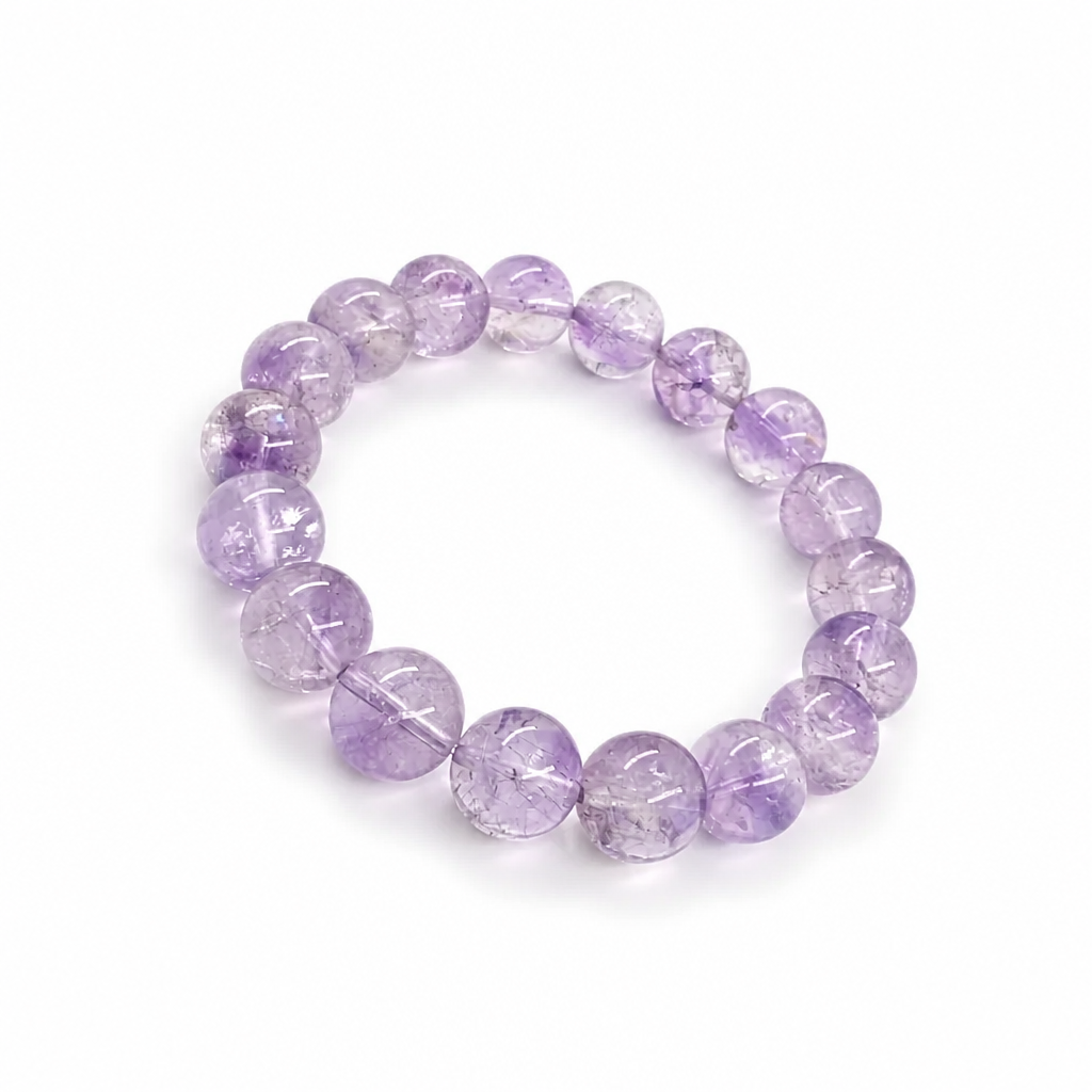 Super Seven bracelet worn on the wrist showing deep violet colour and mineral complexity