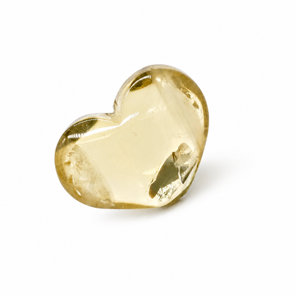 Side view of the solar rainbow citrine heart showing warm golden depth