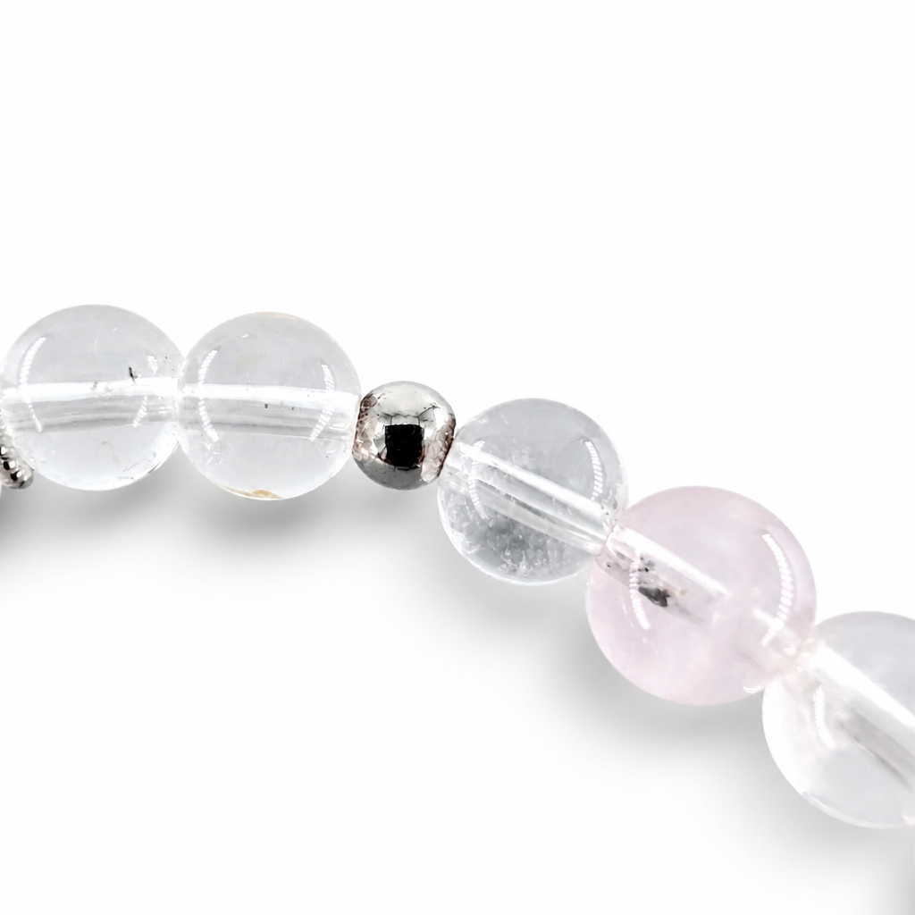 Prismatic Clear Quartz beads alongside deep violet Super 7 and blush Rose Quartz