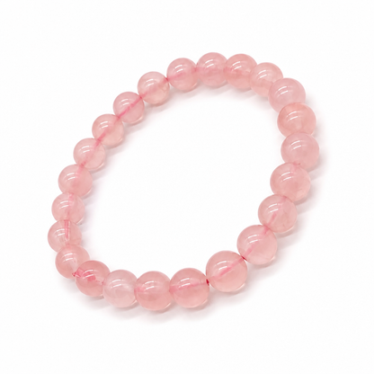 Deep pink rose quartz bracelet on a white background