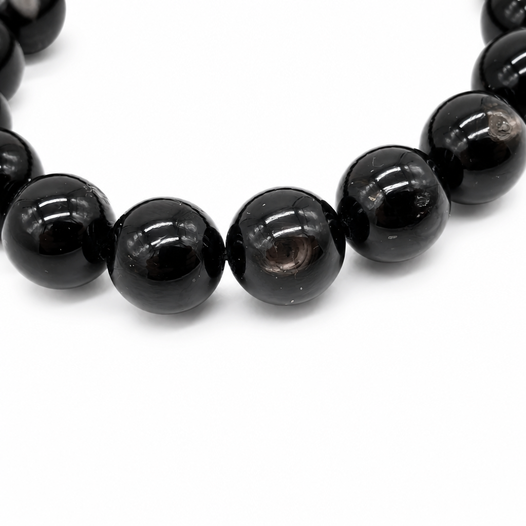Side view of the large-bead hypersthene bracelet showing substantial bead weight