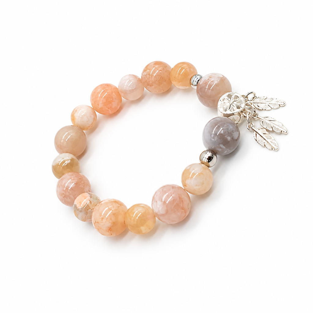 Silver guardian charm hanging from flower agate beads