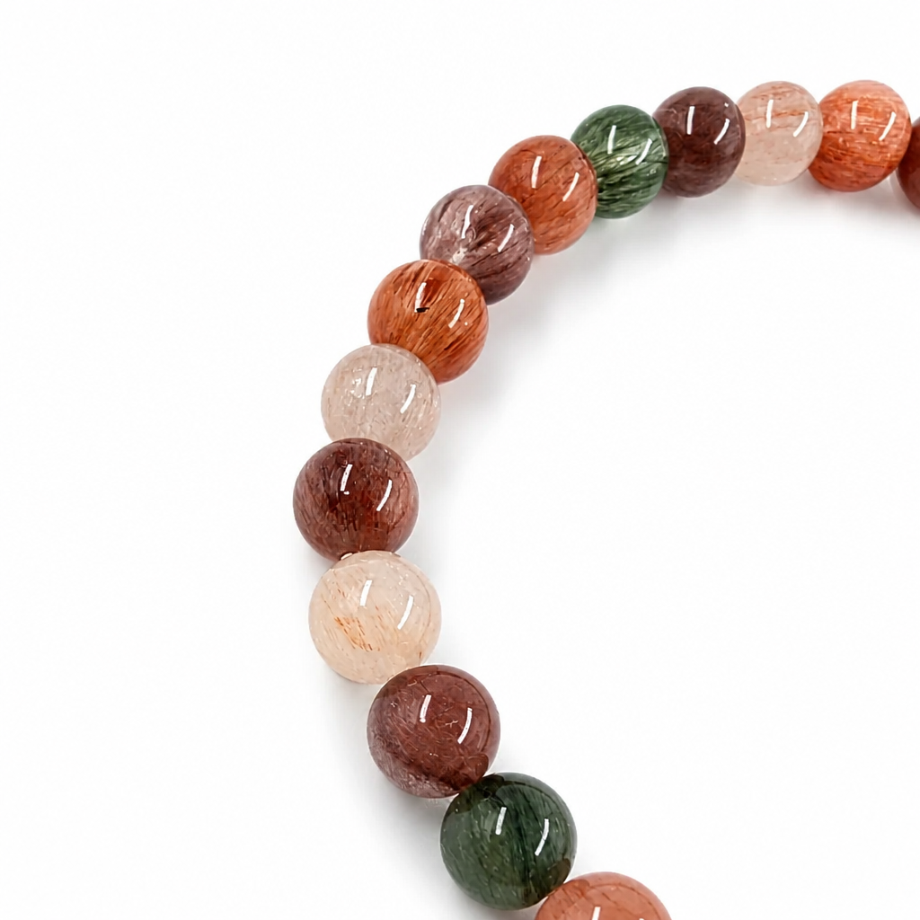 Rabbit Hair Quartz bracelet worn on the wrist showing rose-gold rutile in light