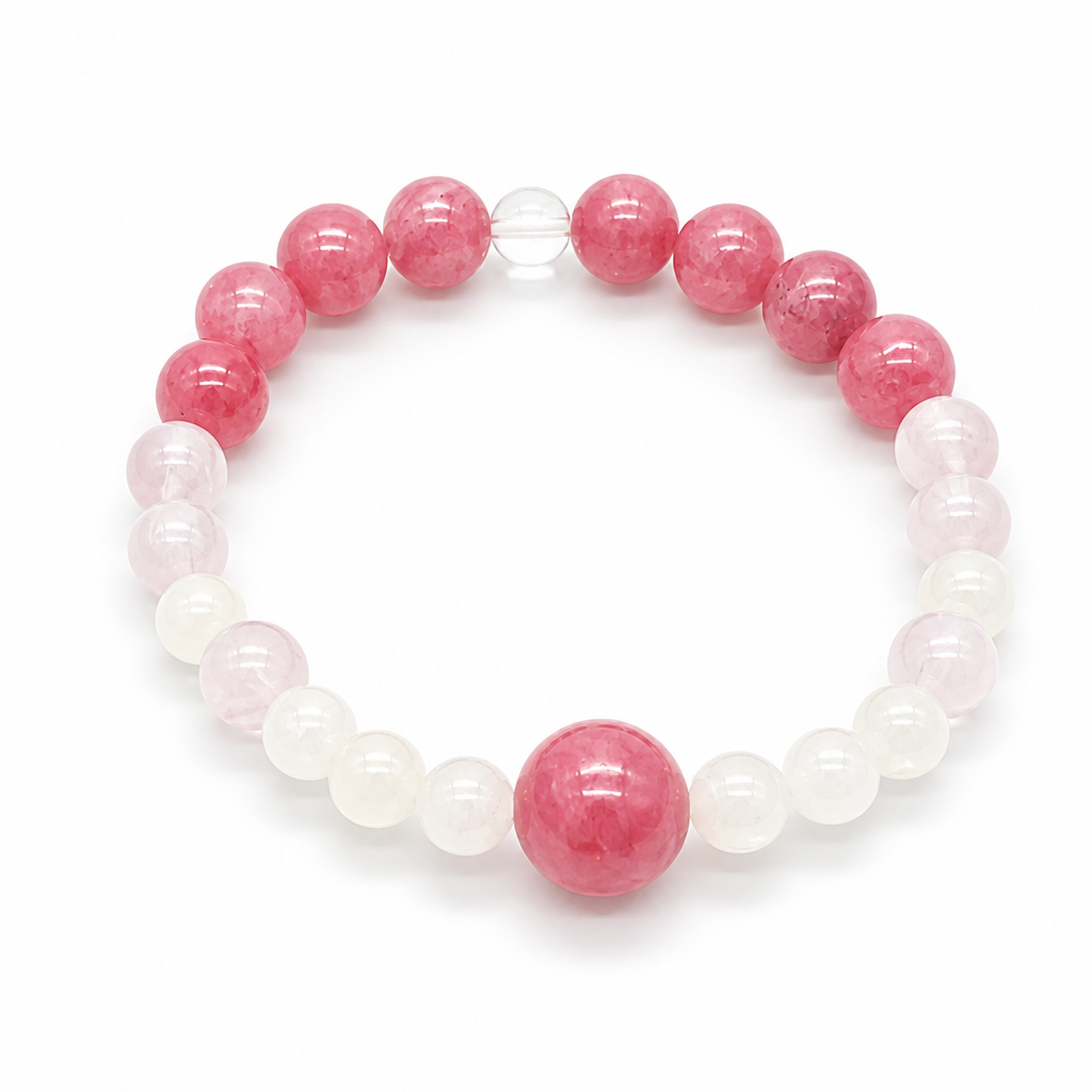 Close-up of rose-pink rhodonite beads with natural black manganese veining