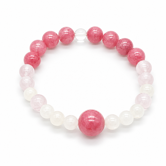 Close-up of rose-pink rhodonite beads with natural black manganese veining