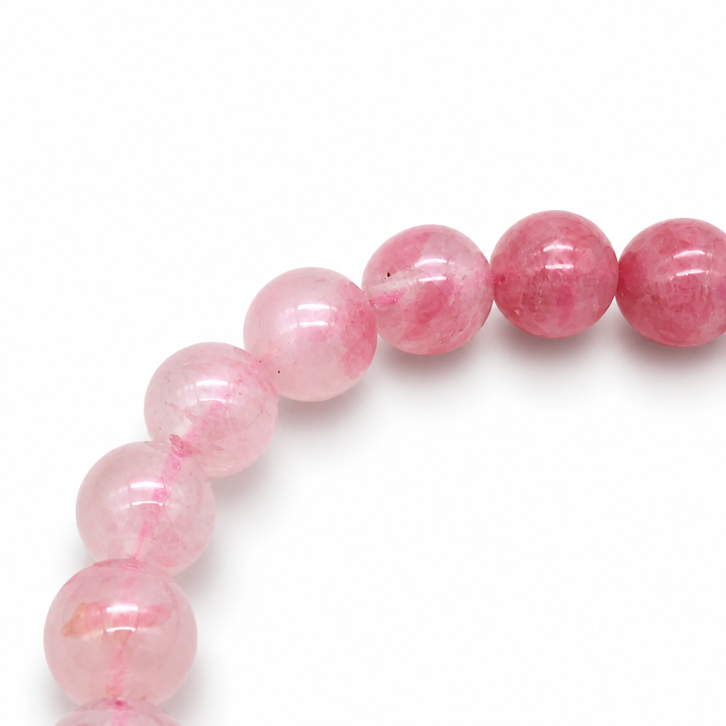 Rhodonite Gradient bracelet resting flat showing full hand-arranged pink-to-rose ombré sequence