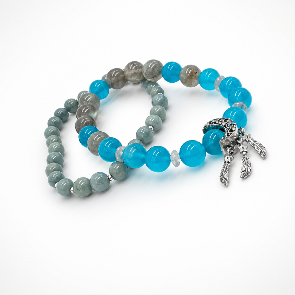 Deep forest-green nephrite jade beads alongside turquoise Amazonite on white surface