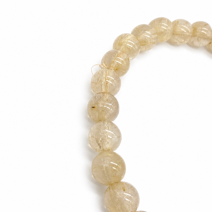 Golden rutilated quartz bracelet shown from the side