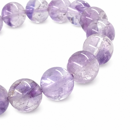 Natural Amethyst Super Seven handmade crystal bracelet by Aura Lune on white background
