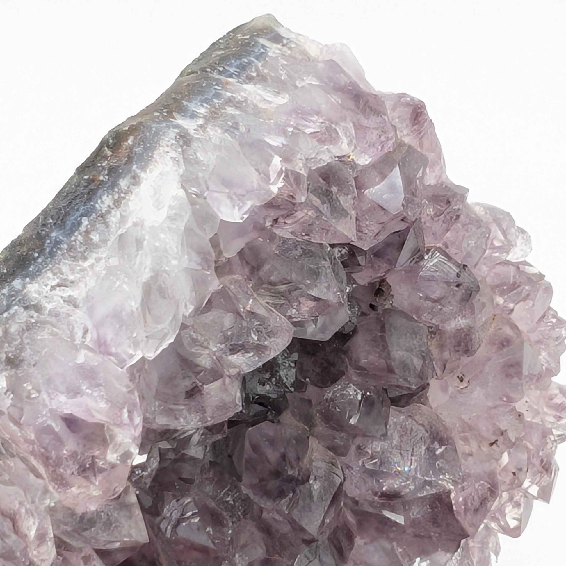 Angled view of the violet peak amethyst spire catching light for rainbow flash