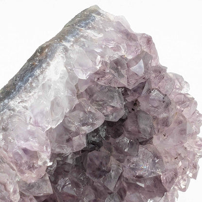 Angled view of the violet peak amethyst spire catching light for rainbow flash