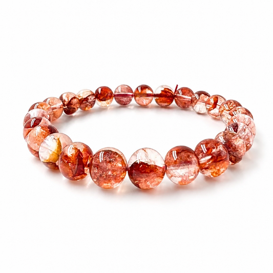Close-up of clear quartz beads with vivid red hematite inclusions