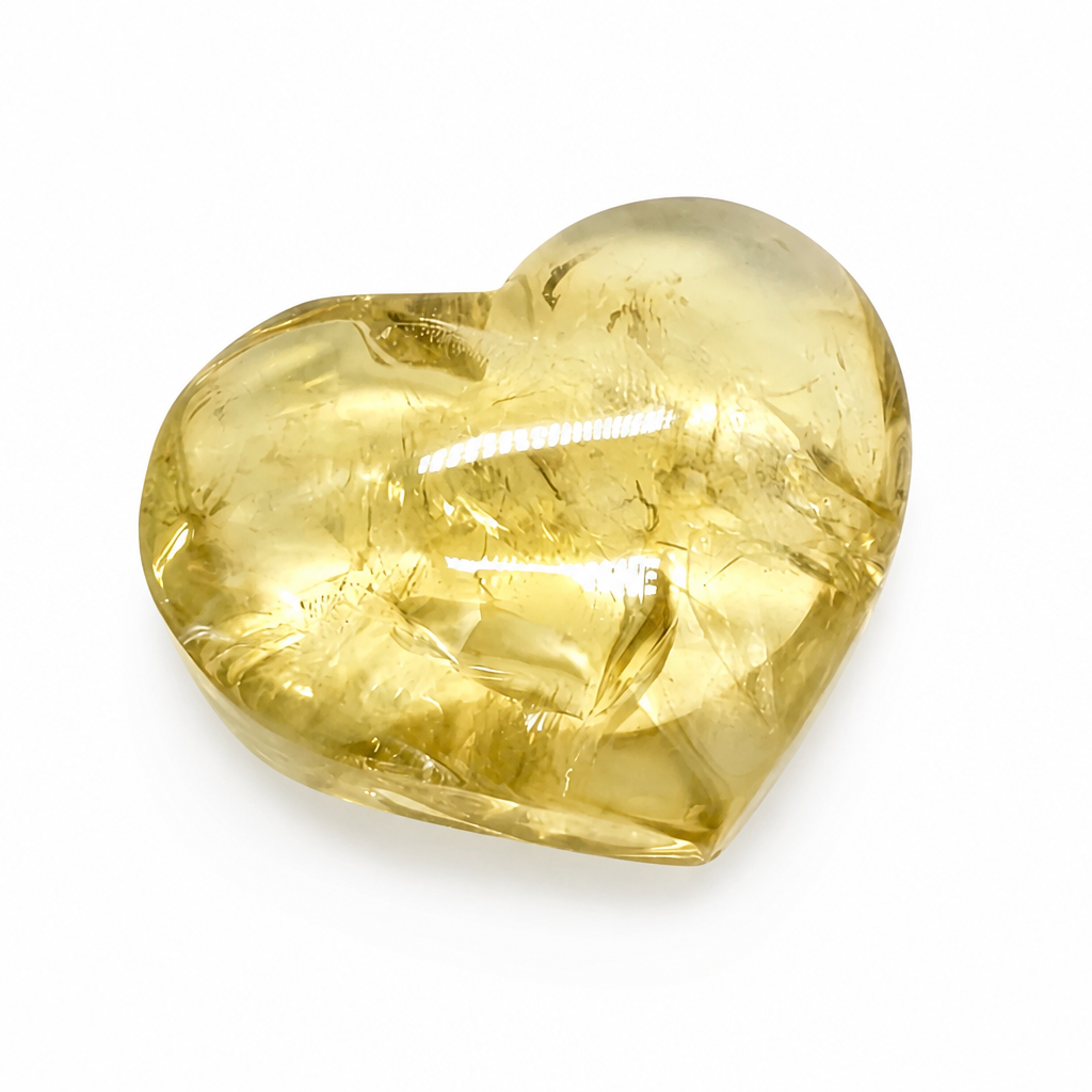 Gilded Citrine heart specimen with warm honey-gold tones on a white surface