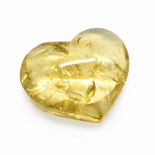 Gilded Citrine heart specimen with warm honey-gold tones on a white surface