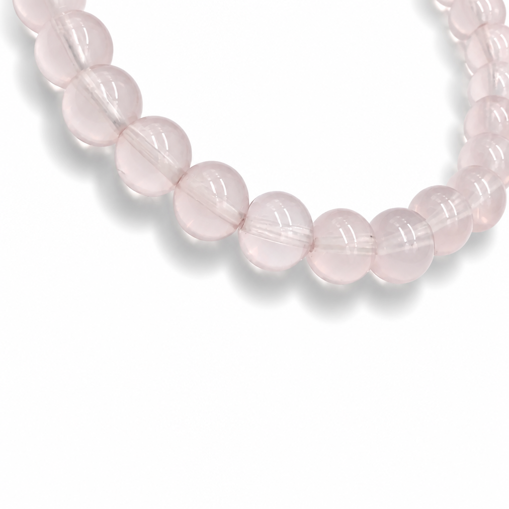 Side view of the Madagascar Star Rose Quartz bracelet showing 7mm bead depth and lavender-pink tone