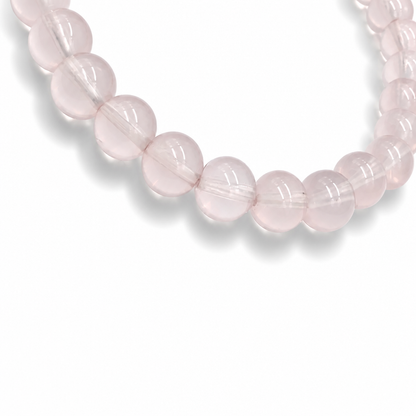 Side view of the Madagascar Star Rose Quartz bracelet showing 7mm bead depth and lavender-pink tone