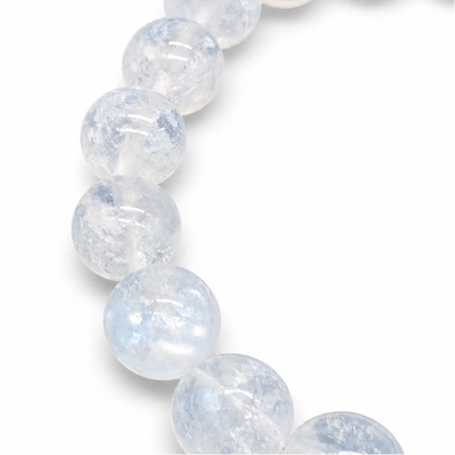 Detail of soft blue and warm peach adularescence on individual Indian Moonstone beads