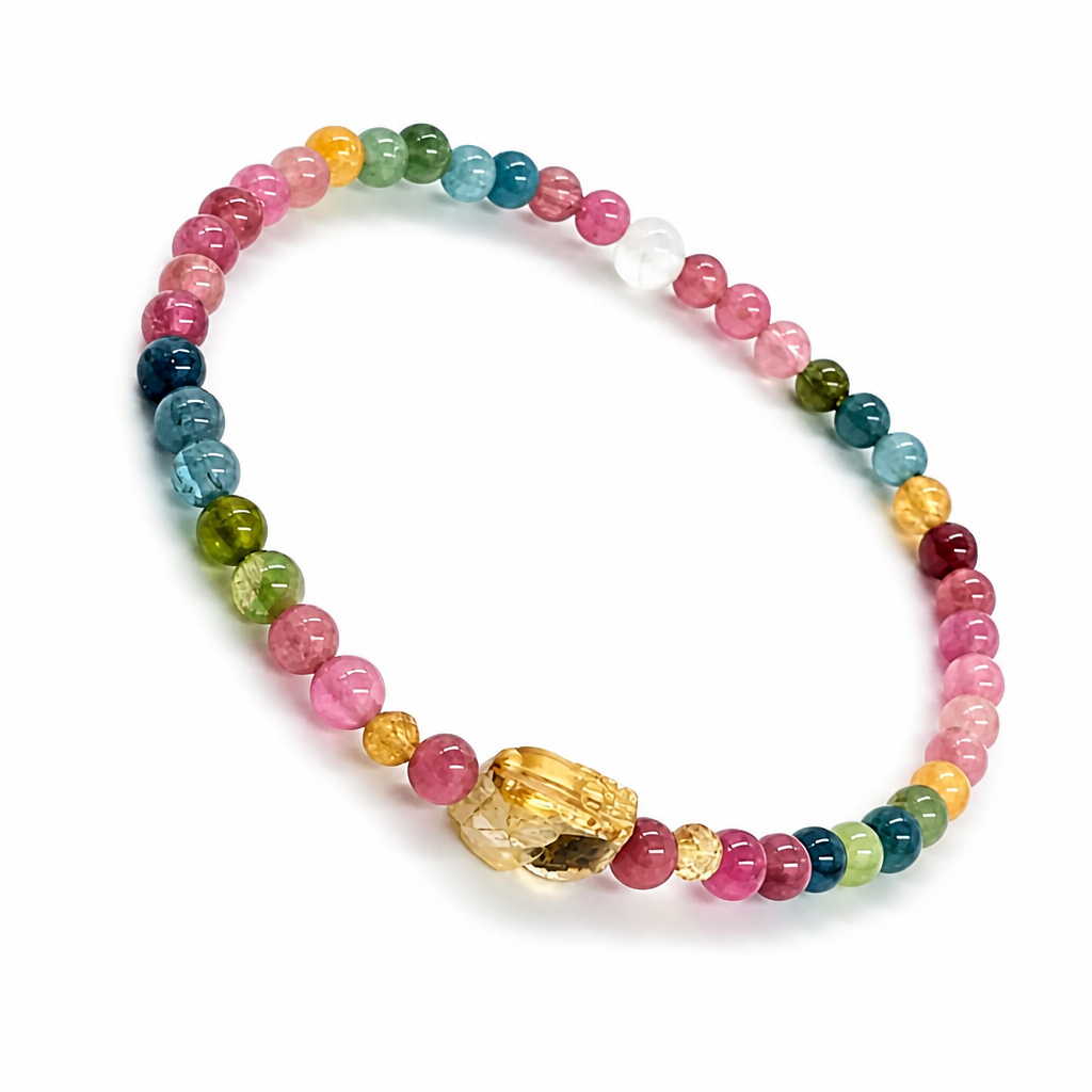 Pixiu Tourmaline Rainbow bracelet with golden Pixiu charm and full-spectrum beads on white