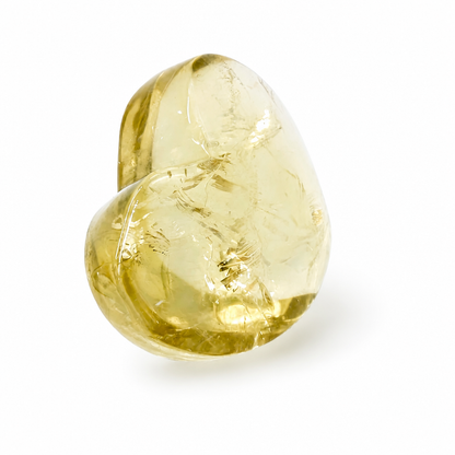 Side view of the gilded citrine heart showing warm golden depth and compact form