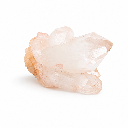 Pink Samadhi Quartz cluster with wide horizontal formation on a white surface