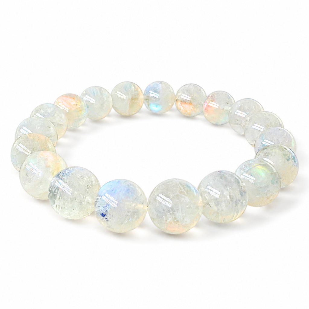 Close-up of rosy-pink adularescence drifting across a 10mm Madagascar Moonstone bead