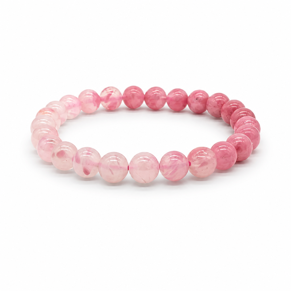 Rhodonite Gradient bracelet worn on the wrist showing dusty pink end deepening to saturated rose