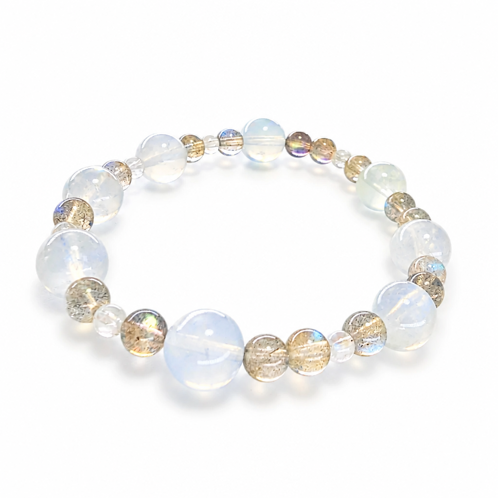 Moon Tide Moonstone bracelet with silvery-blue adularescence on a white surface