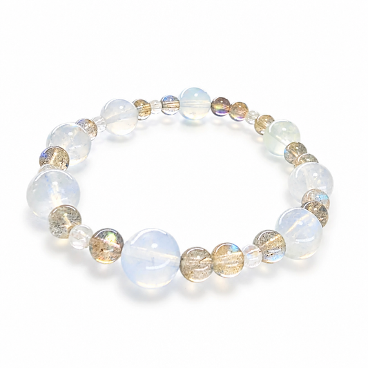 Moon Tide Moonstone bracelet with silvery-blue adularescence on a white surface