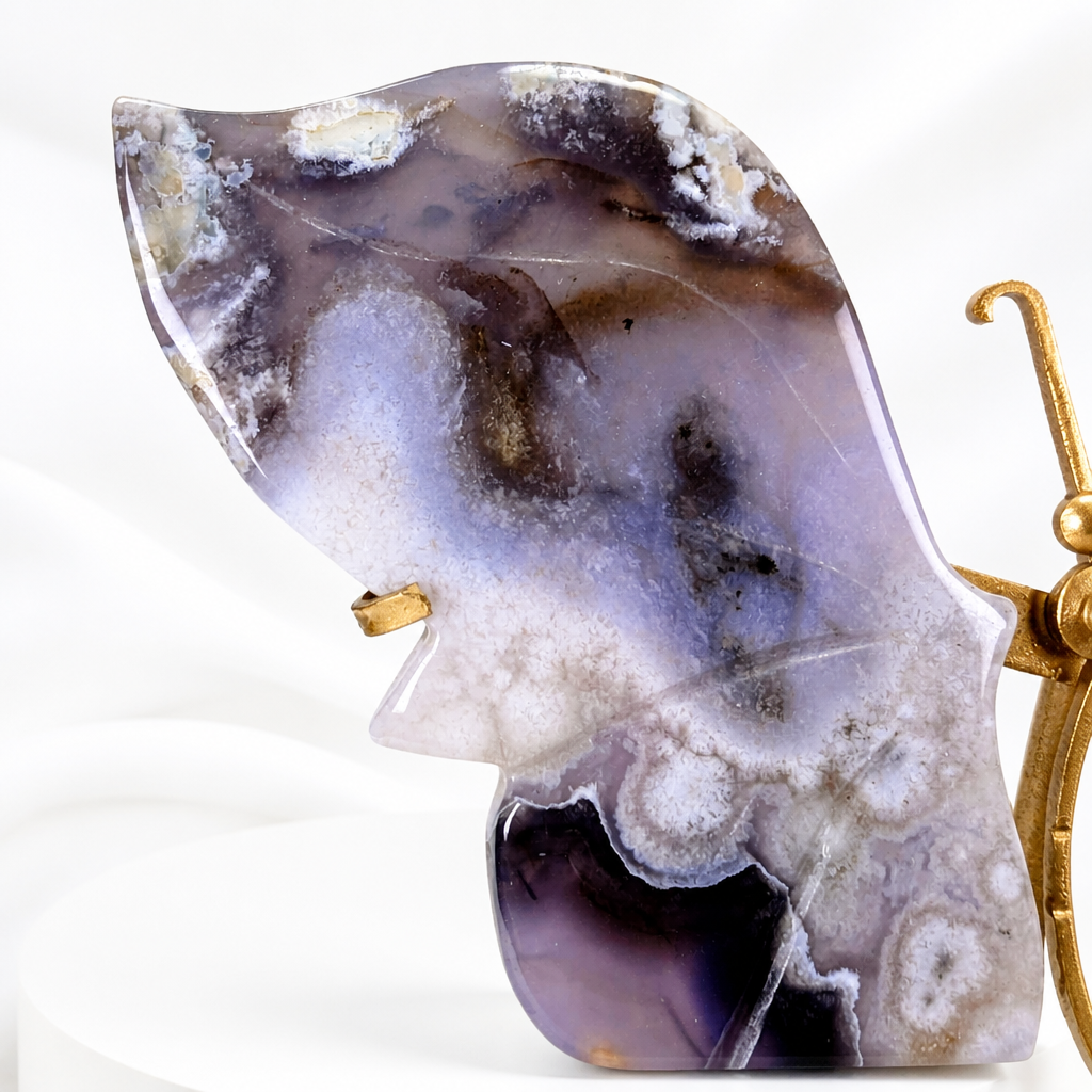 Blue flower agate butterfly displayed against a soft white background