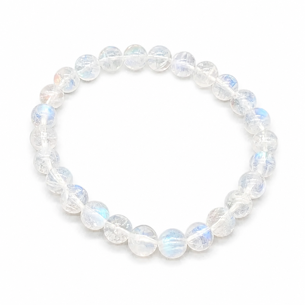 Madagascar Rainbow Moonstone bracelet with 6mm blue-white flash beads on white surface