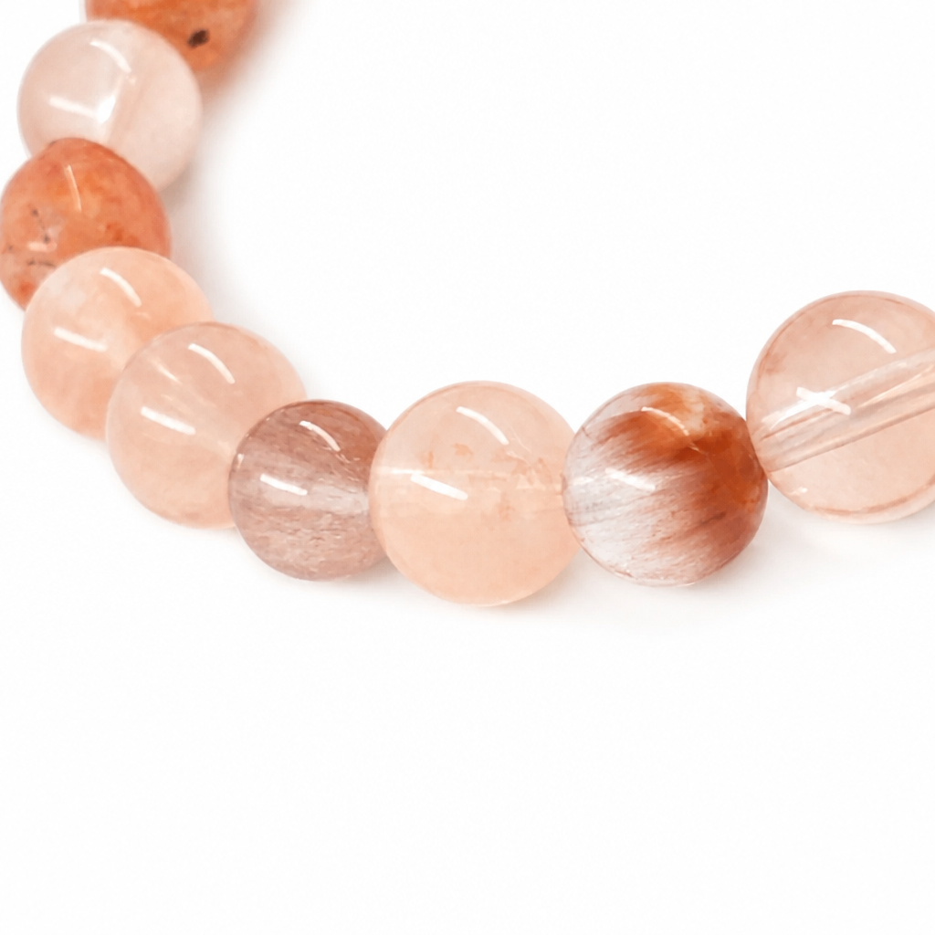 Side view of the two-stone sunstone and rutilated quartz bracelet