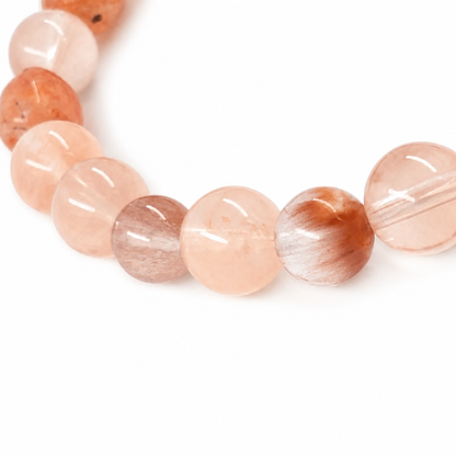 Side view of the two-stone sunstone and rutilated quartz bracelet