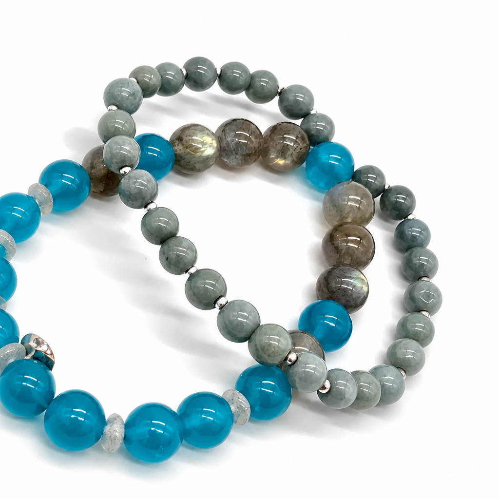 Side view of the Moonlit Oasis bracelet showing mixed 5-8mm bead sizing and charm placement