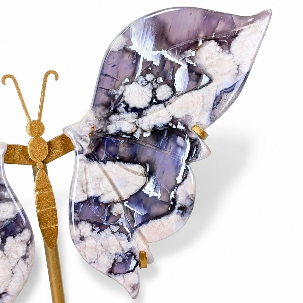 Close-up of white bloom patterns inside deep blue flower agate