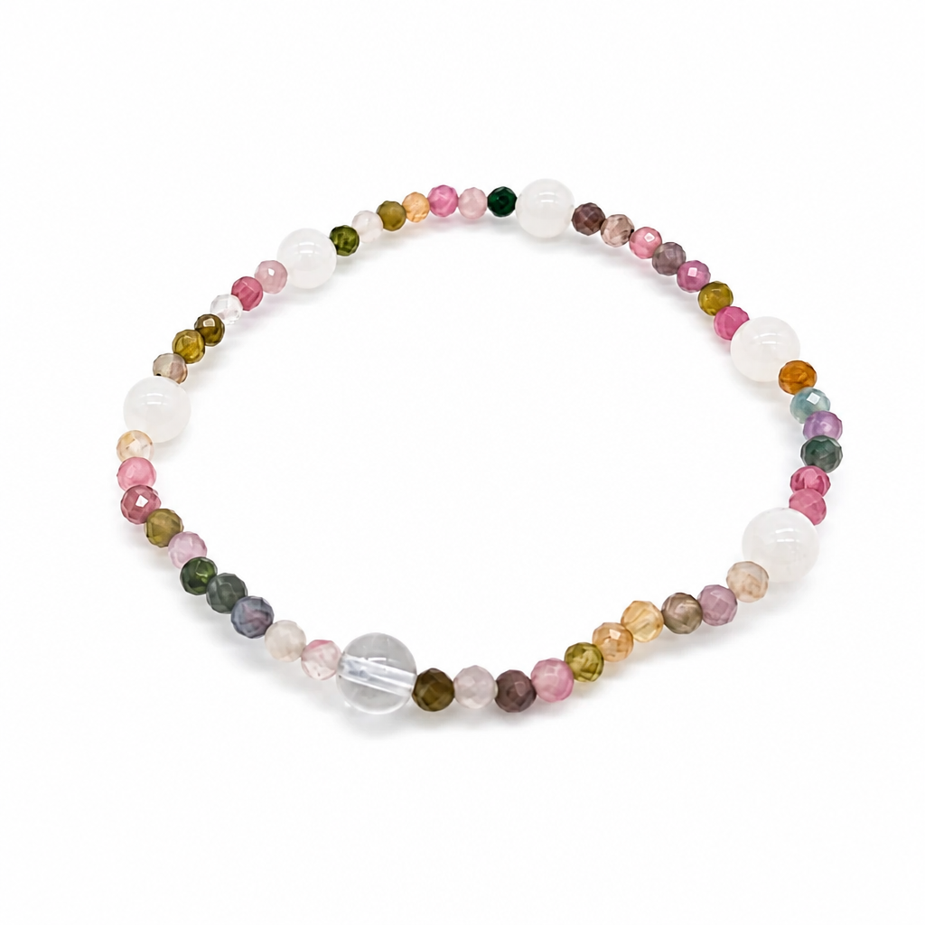 Close-up of multi-coloured rainbow tourmaline and milky moonstone beads