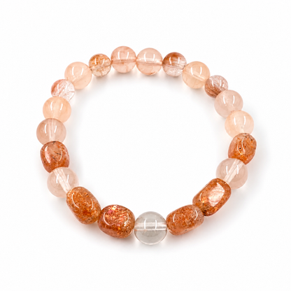 Sunstone and Rabbit Hair Quartz bracelet with warm amber and rose-gold tones on white