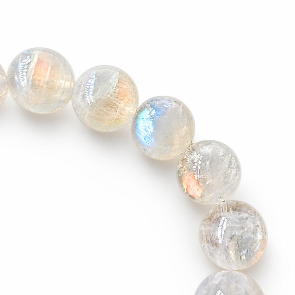 Detail of deep consistent pink moonstone flash in a collector-grade Madagascar Moonstone bead