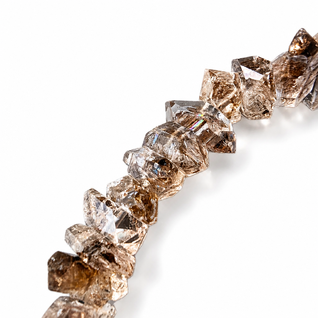 Freeform Herkimer-style quartz crystal catching prismatic light