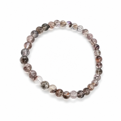 Black Super Seven bracelet worn on the wrist showing near-black mineral complexity
