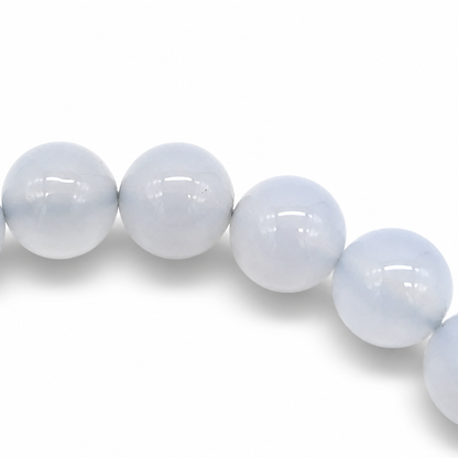 Detail of soft uniform sky-blue colour across individual Blue Chalcedony microcrystalline quartz beads