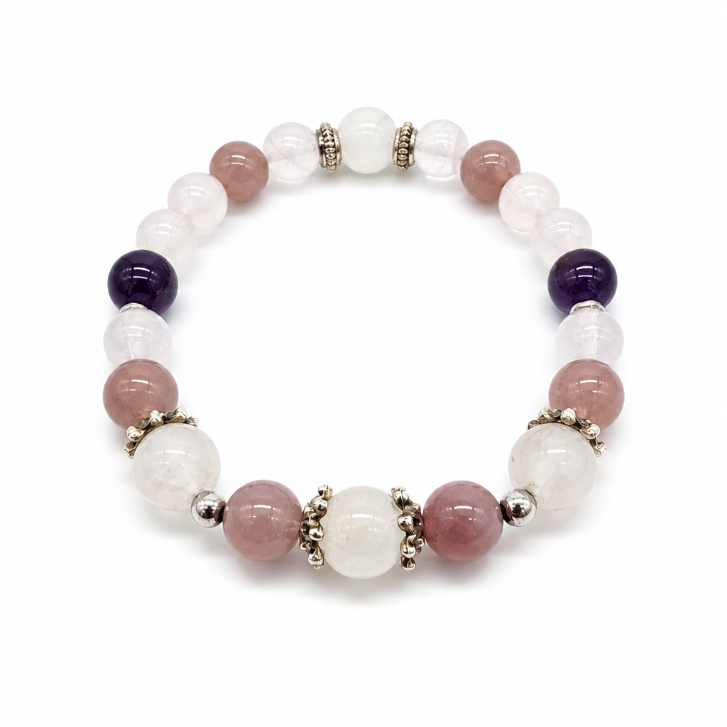 Close-up of deep violet amethyst, adularescent moonstone and lavender rose quartz beads