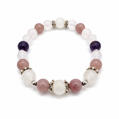 Close-up of deep violet amethyst, adularescent moonstone and lavender rose quartz beads