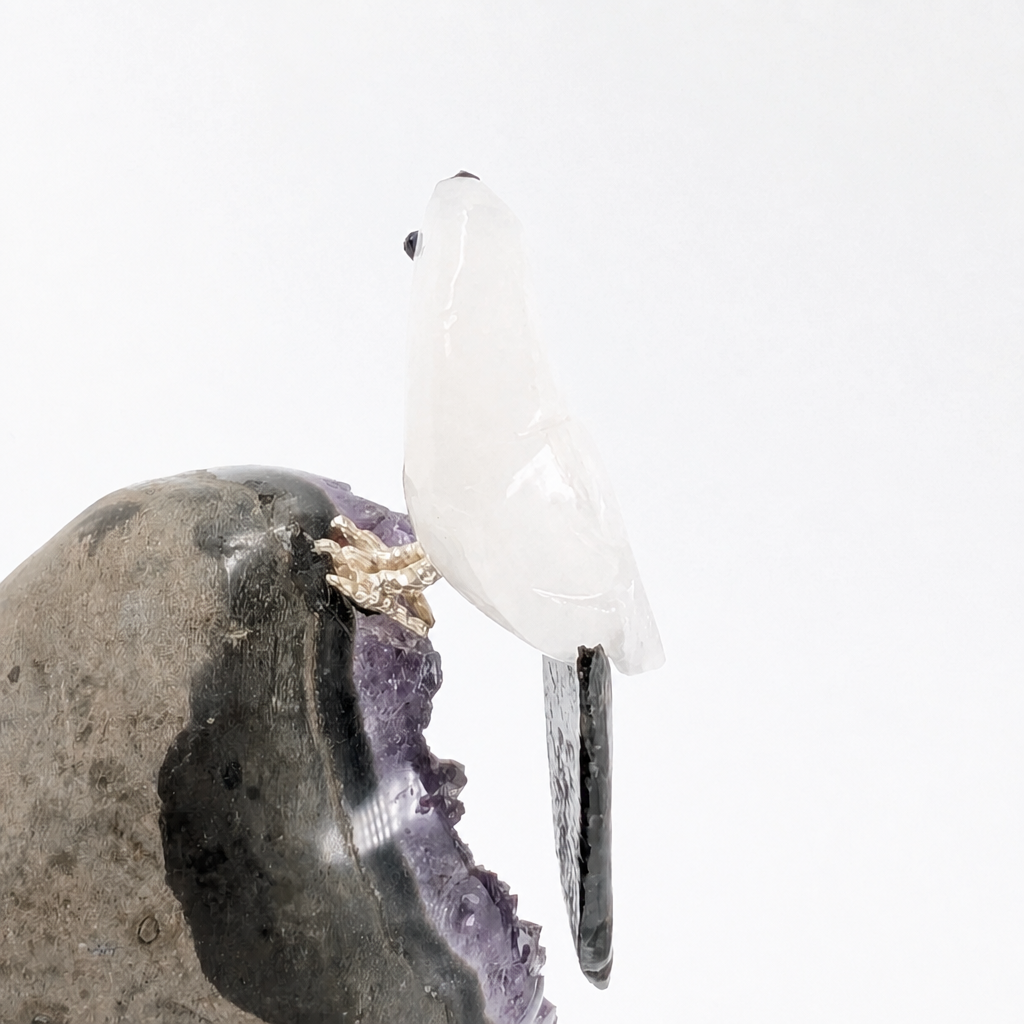 Violet amethyst cluster with carved parrot companion in natural light