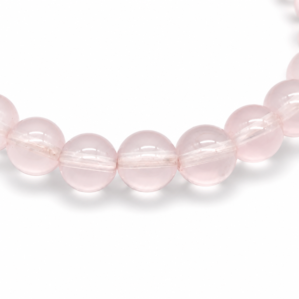 Angled view of Star Rose Quartz bracelet catching light to reveal moving six-rayed asterism