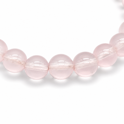 Angled view of Star Rose Quartz bracelet catching light to reveal moving six-rayed asterism